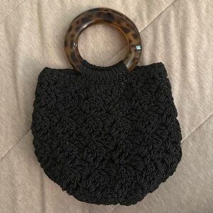 Woman’s mini crochet bag. Black